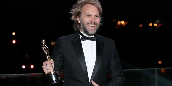 Florian Zeller holds his Oscar